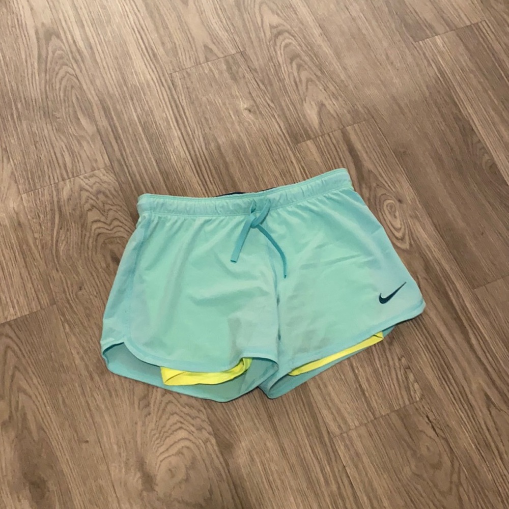 Light teal Nike running shorts